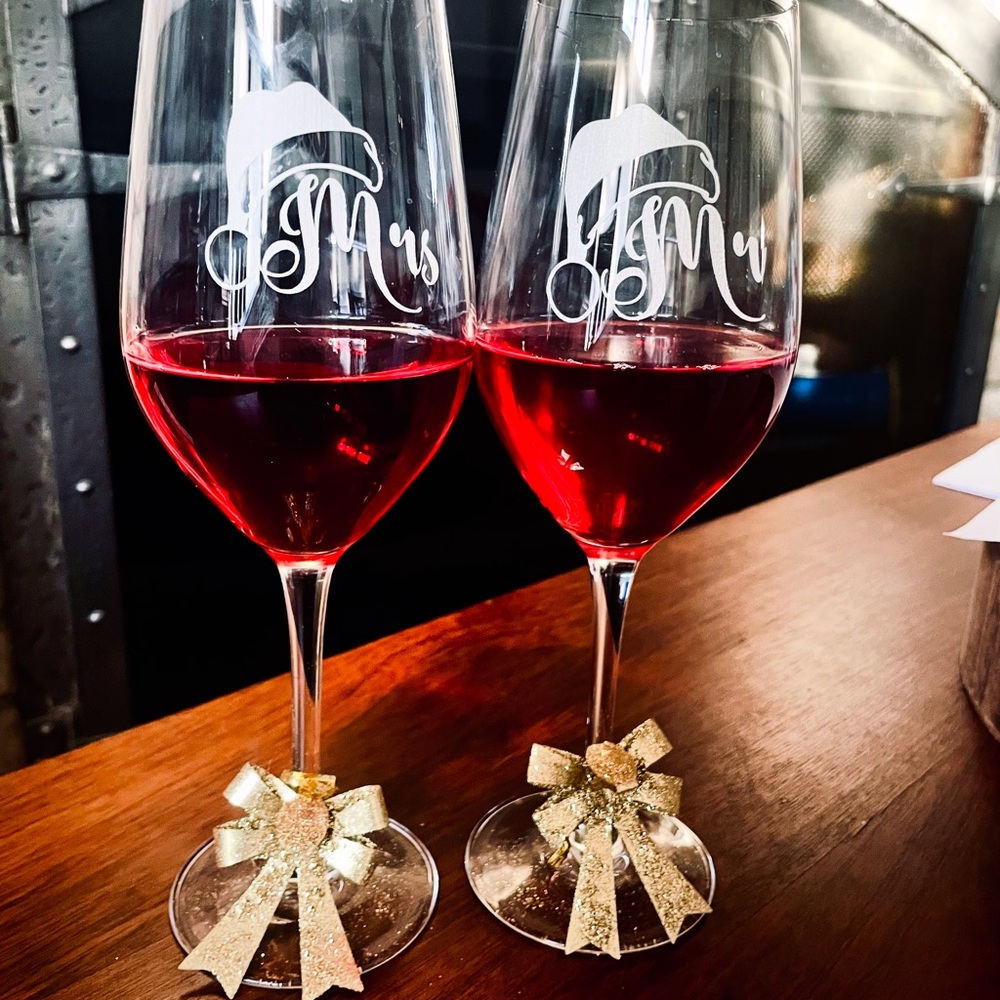 Mr and Mrs  Santa hat glasses.